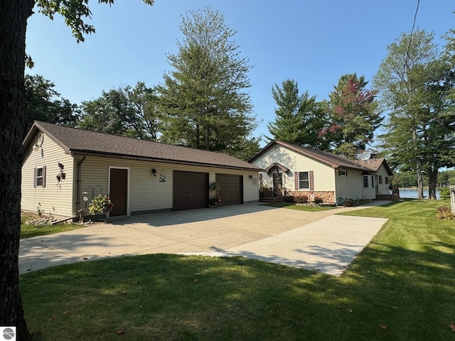 ranch-style house with a front yard and a garage