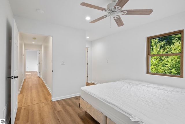 bedroom featuring light wood-type flooring and ceiling fan