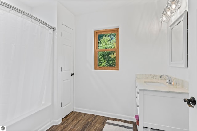 bathroom with vanity and hardwood / wood-style floors