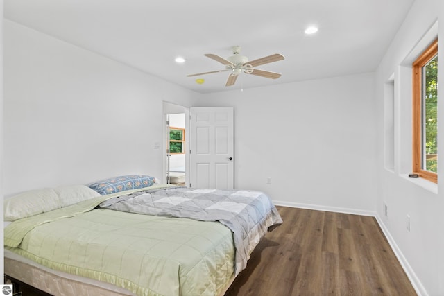 bedroom with dark wood-type flooring and ceiling fan