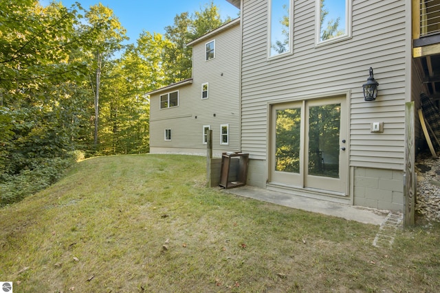 rear view of house with a lawn