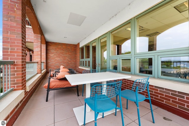 view of patio featuring a balcony