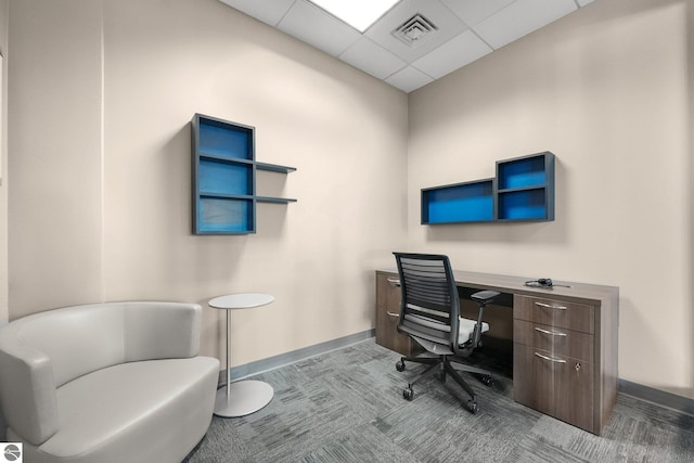 office featuring light carpet and a paneled ceiling