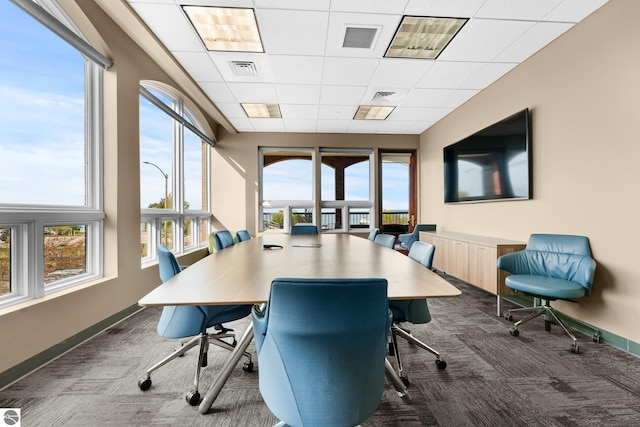 office featuring a drop ceiling and dark colored carpet