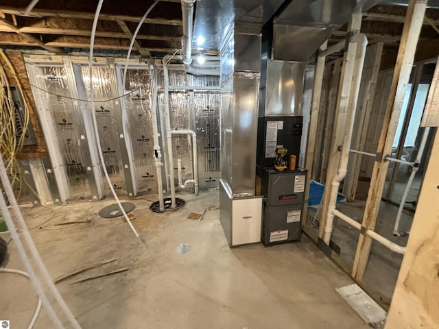 utility room featuring heating unit