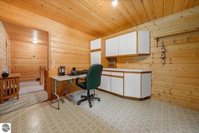 office area featuring wood ceiling and wooden walls