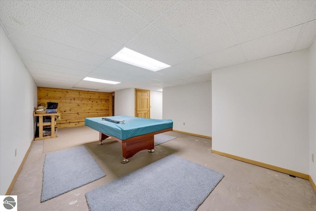 recreation room featuring wooden walls, billiards, and a drop ceiling