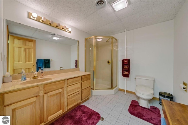 bathroom featuring vanity, tile patterned flooring, toilet, and an enclosed shower