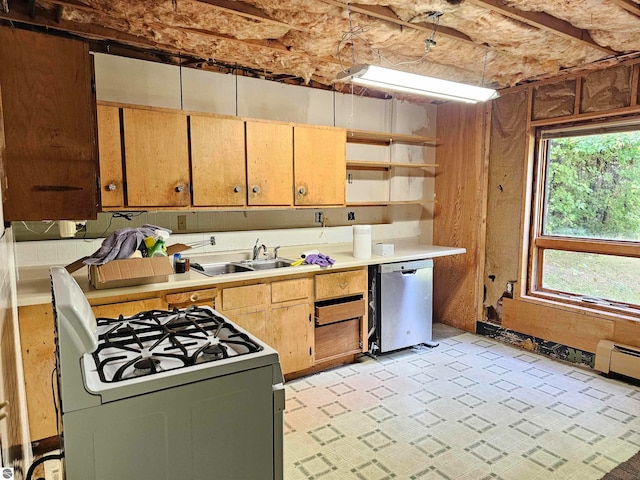 kitchen featuring dishwasher, white range with gas stovetop, and sink