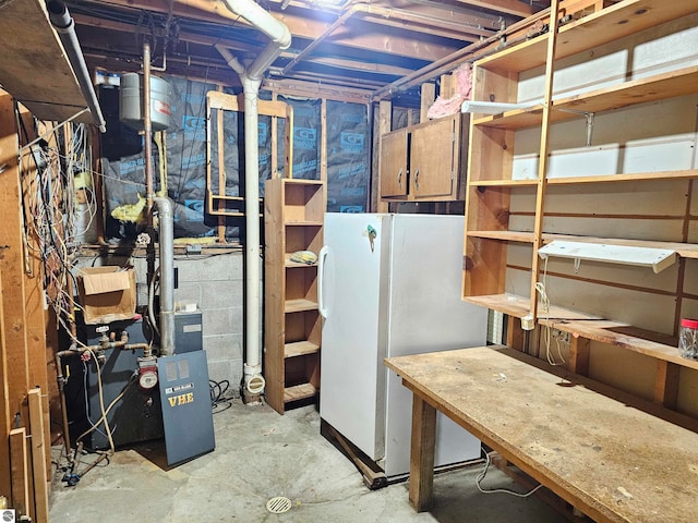 basement featuring white fridge