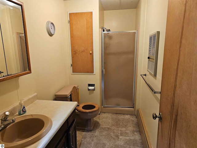 bathroom featuring a baseboard radiator, vanity, an enclosed shower, and toilet