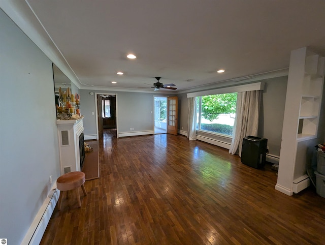 unfurnished living room with a baseboard heating unit, ornamental molding, dark hardwood / wood-style flooring, and ceiling fan