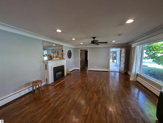 unfurnished living room with ornamental molding, dark hardwood / wood-style floors, and ceiling fan