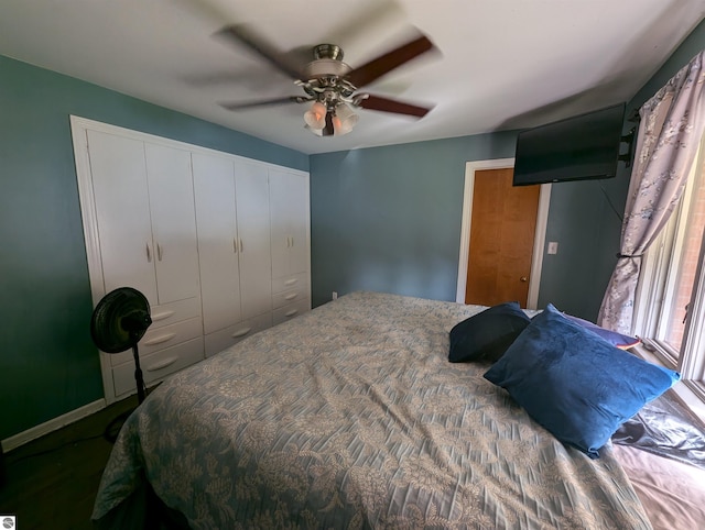 bedroom with ceiling fan and a closet