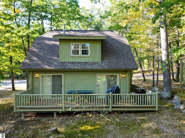 view of front facade with a wooden deck