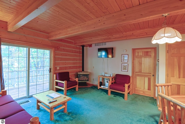 carpeted living room with beamed ceiling, wood ceiling, and a wood stove