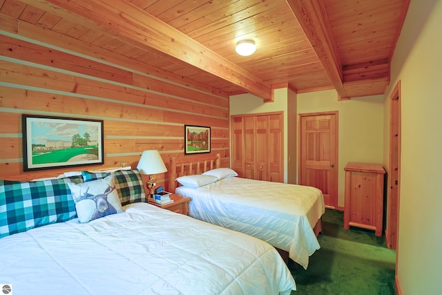 carpeted bedroom featuring wood ceiling and beam ceiling