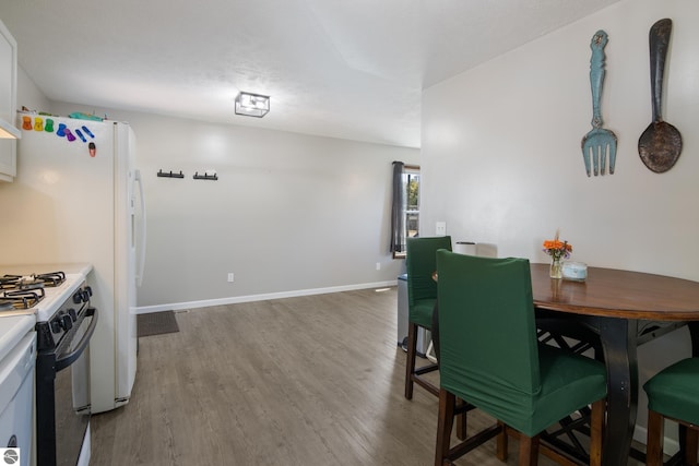 dining area featuring hardwood / wood-style flooring