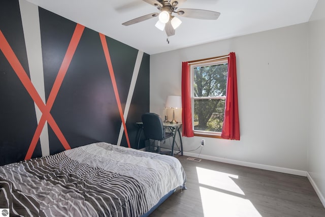 bedroom featuring wood-type flooring and ceiling fan