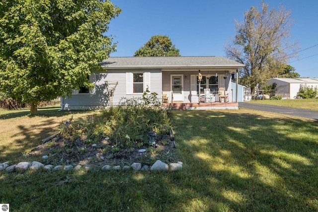 view of front of home with a porch and a front lawn