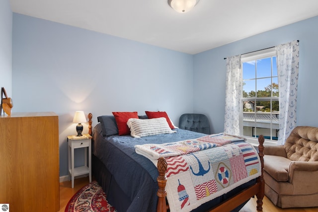 bedroom with light hardwood / wood-style flooring