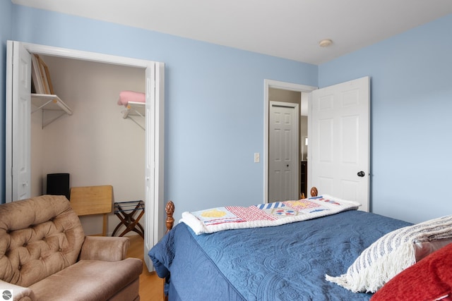 bedroom with hardwood / wood-style floors