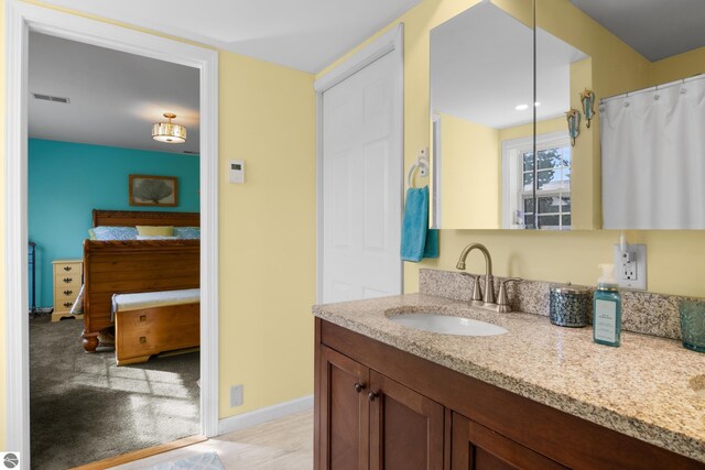 bathroom with vanity and a shower with shower curtain