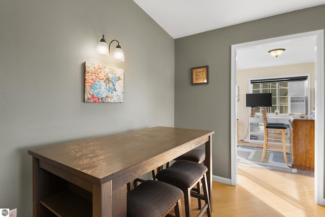 dining space with light hardwood / wood-style floors