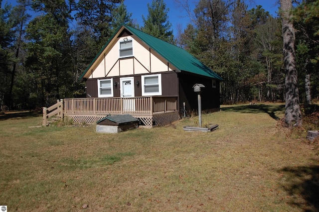 exterior space with a deck and a yard