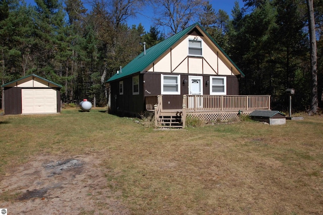 view of front facade featuring a storage shed, a front yard, and a deck