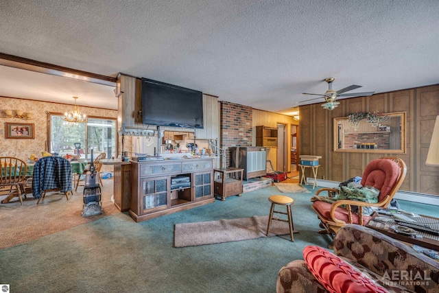 living room featuring ceiling fan with notable chandelier, a textured ceiling, a baseboard radiator, and carpet floors