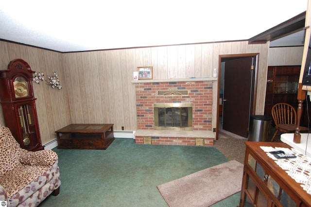 2169 Brady Dr, West Branch, MI 48661 - living area featuring a baseboard heating unit, carpet floors, wood walls, and a fireplace