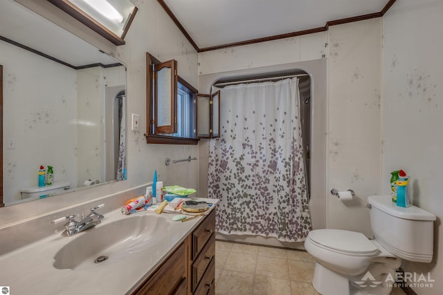 bathroom featuring ornamental molding, vanity, and toilet