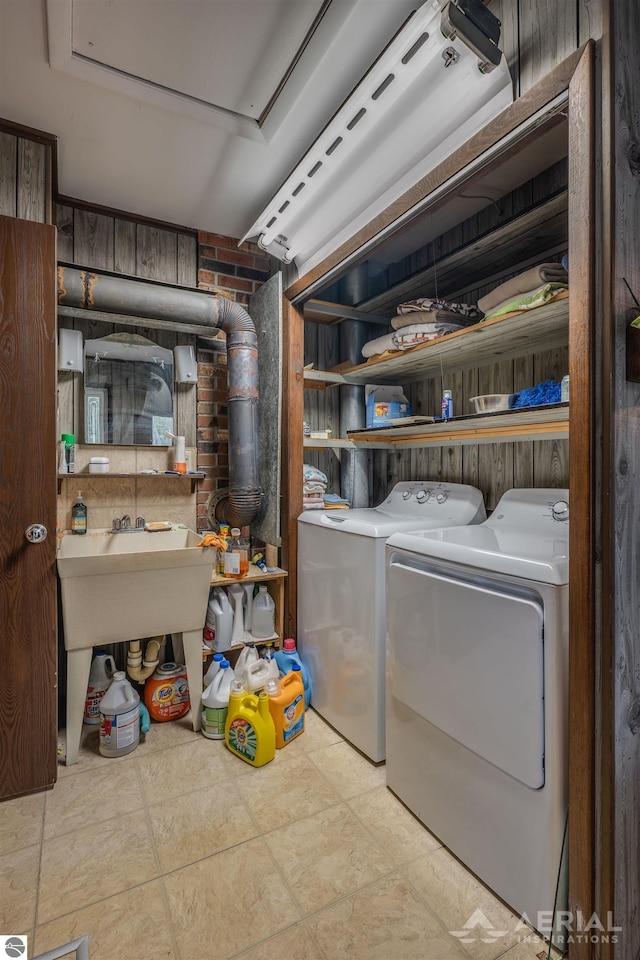 washroom with washing machine and clothes dryer