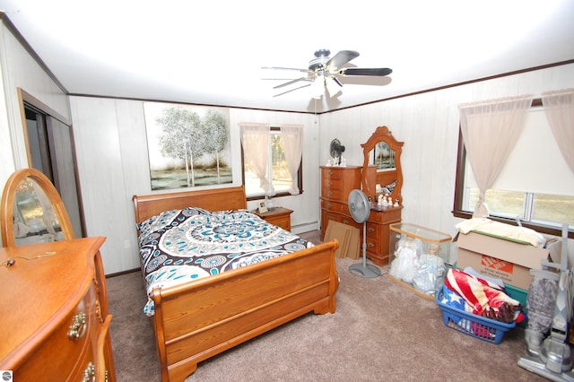 2169 Brady Dr, West Branch, MI 48661 - bedroom with carpet flooring, baseboard heating, a ceiling fan, and ornamental molding