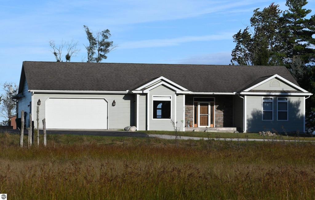 single story home with a garage