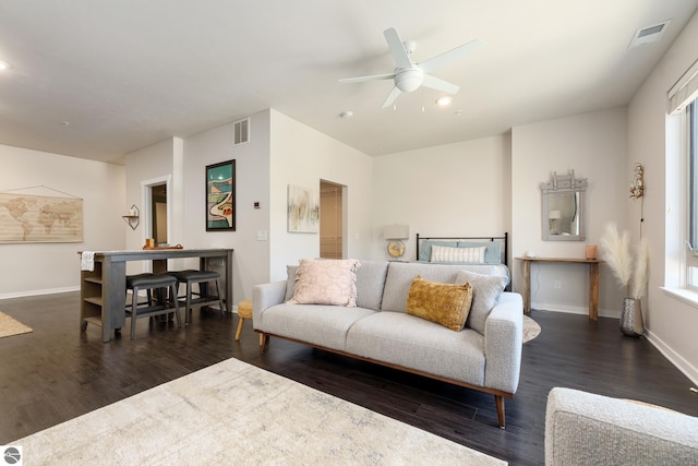 bedroom with ceiling fan and dark hardwood / wood-style floors