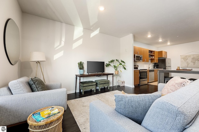 630 S Garfield, Traverse City, MI 49686 - living room featuring recessed lighting, dark wood-style floors, and baseboards