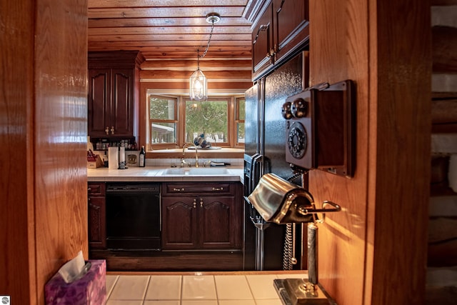 kitchen featuring dishwasher, light tile patterned flooring, hanging light fixtures, and dark brown cabinetry