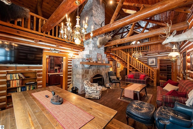 living room with beamed ceiling, hardwood / wood-style flooring, a fireplace, and high vaulted ceiling