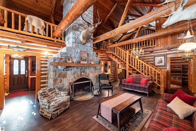 living room featuring wood ceiling, hardwood / wood-style flooring, beam ceiling, high vaulted ceiling, and a stone fireplace