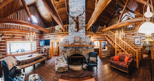 living room with beam ceiling, a stone fireplace, high vaulted ceiling, hardwood / wood-style flooring, and wooden ceiling