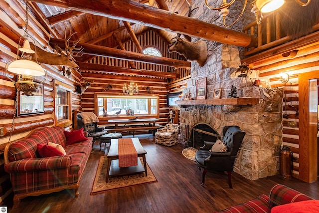 living room featuring log walls, high vaulted ceiling, a stone fireplace, hardwood / wood-style flooring, and a chandelier