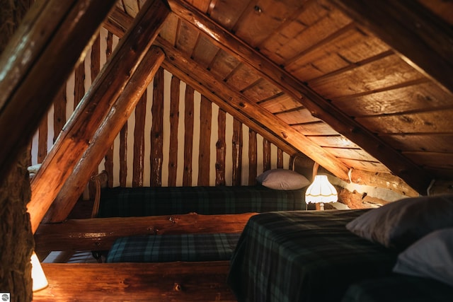 bedroom featuring wooden ceiling and lofted ceiling with beams