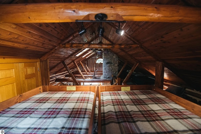 unfurnished bedroom with wooden ceiling and lofted ceiling with beams