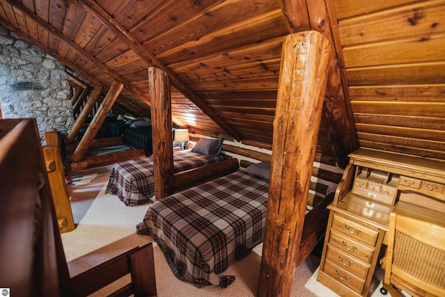 bedroom with lofted ceiling and carpet flooring