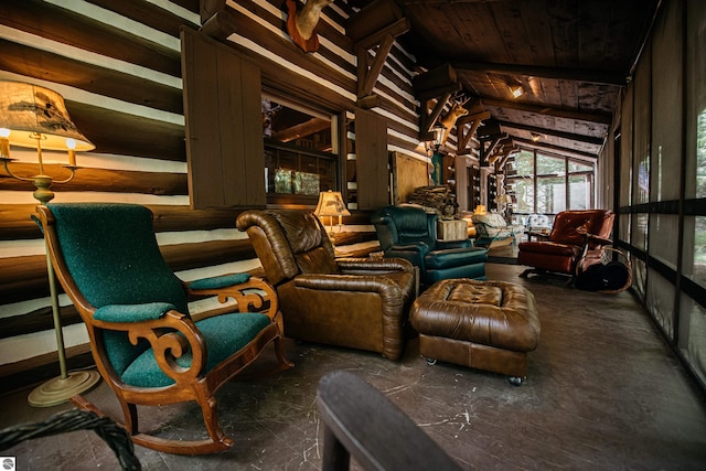 interior space with wood walls, vaulted ceiling, and wooden ceiling