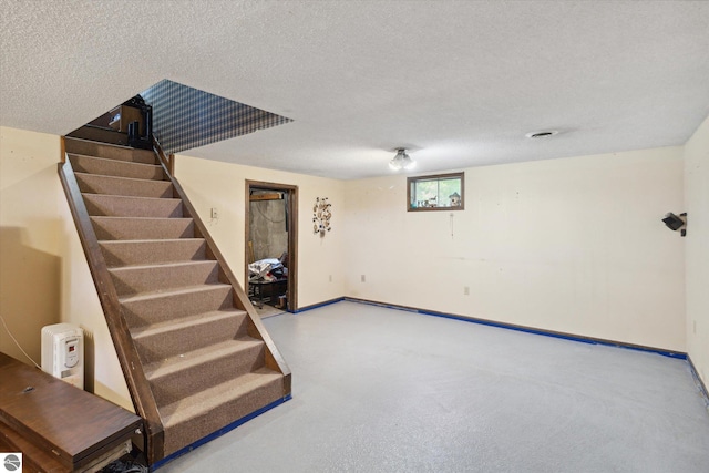 interior space with a textured ceiling