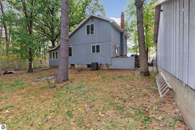 back of property with central air condition unit