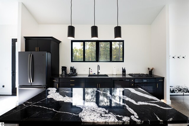 kitchen with hanging light fixtures, sink, and black appliances